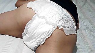 Wearing White Diapers And Scrubing On The Pillow Horny...