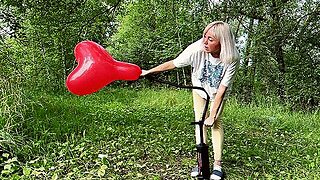 Alla Destroys Three Balloons With A Hand Pump