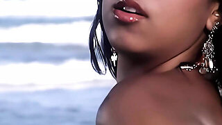 Two Really Attractive Women Engaged In Intimate And Intense Sexual Activity With A Man On The Beach.
