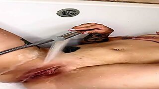Big-Ass Latina Gently Washes Breasts And Stimulates Cunt With Water Stream