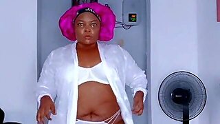 Black Hawt Big Beautiful Woman In White Strap Pants And Brassiere