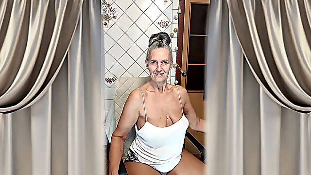 Cheerful Housewife Lukerya Dances In The Kitchen And Drinks Coffee In The Morning.
