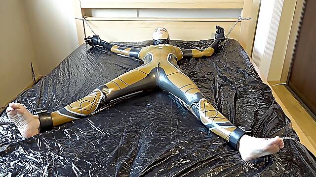 Latex Danielle Is Attached To The Bed And Masturbated With The Massage Vibrator